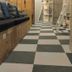 bnbplus Niigata Book Inn in Niigata, checkered hallway with built-in bench seating and shelving