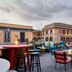 Rooftop terrace at citizenM Rome Isola Tiberina in Rome with colorful seating and city views