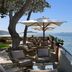 Grand Hotel Ambasciatori in Sorrento: seaside terrace with umbrellas, lounge chairs, and sea views