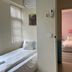 Rhine Castle Hotel in Taichung City, two small bedrooms with single beds and pastel decor