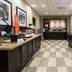 Hampton Inn By Hilton Elliot Lake breakfast area with counters, coffee station and checkered tile floor
