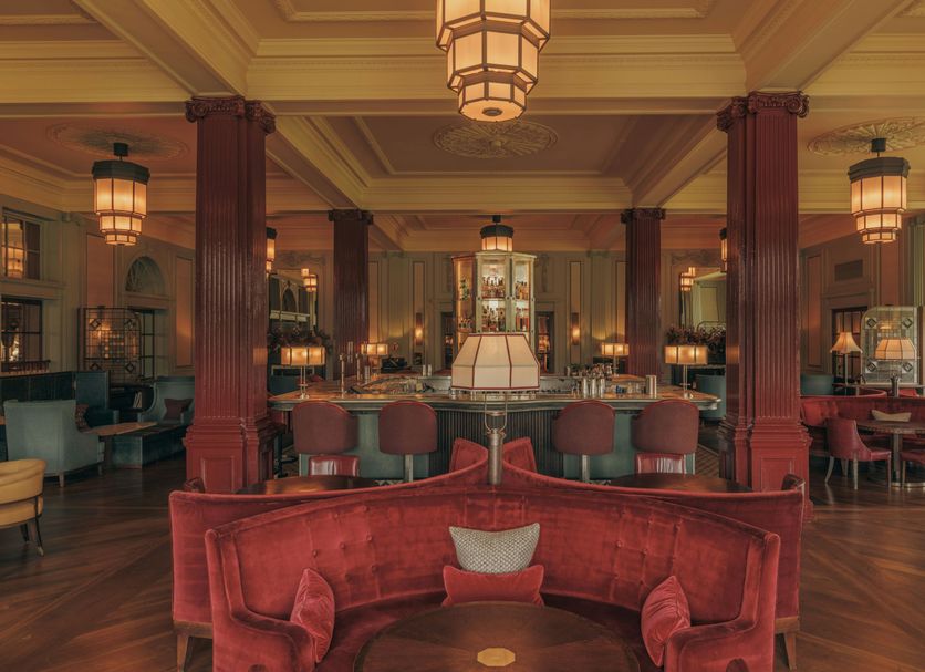 The Gleneagles Hotel, Auchterarder: elegant hotel lounge with red velvet seating and chandeliers