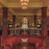 The Gleneagles Hotel, Auchterarder: elegant hotel lounge with red velvet seating and chandeliers