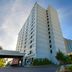 Hampton Inn New York-JFK in Queens, exterior view of a tall hotel tower with Hampton Inn sign