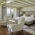 The Grand Hotel Golf Resort & Spa, Autograph Collection guest room with balcony and sitting area in Point Clear