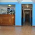 Hotel Blue Star II in Foz do Iguaçu lobby with reception desk, blue walls and tiled hallway