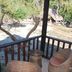 Palawan Sandcastles The Beach House in Busuanga, balcony with wicker chairs and beach view