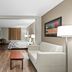 Red Roof Inn Etowah - Athens, TN suite with sofa, TV, desk and bed in Etowah