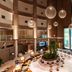 Lobby atrium at Delta Hotels by Marriott Olbia Sardinia in Olbia with hanging globe lights and central planter
