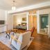 Les Suites de Bellac in Bellac: spacious suite with seating area, desk, bedroom, and bathroom view