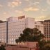 Ginger Jaipur hotel exterior at sunset with city buildings and cloudy sky in Jaipur