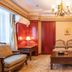 Nan Fang Hotel Huzhou elegant guest room with chandelier, seating area, coffee table and wood furnishings