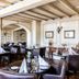 Fletcher Hotel-Restaurant La Ville Blanche in Thorn restaurant with set tables and arched mirrors