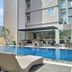 Horison Hotel Sukabumi in Sukabumi with outdoor pool and poolside loungers beside the building