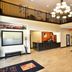 Berlin Grande Hotel lobby in Berlin with chandelier, mezzanine railing and staircase