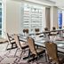 Home2 Suites by Hilton Chicago McCormick Place meeting room with long conference table and city views