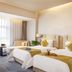 Guanyuan Liusu Hotel in Suzhou twin guest room with two beds and window seating area