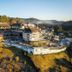 Chris Park Hotel in Campos do Jordão on a hillside with terraced buildings and forest views