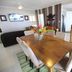 Vanuatu Beachfront Apartments in Port Vila with dining table, lounge and open kitchen interior