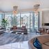 Cambria Hotel Waco University Riverfront lobby with floor-to-ceiling windows and city views