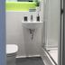 Aparto Dorset Point City Centre Accommodation, Dublin: compact bathroom with shower, sink and backlit mirror