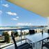 Pumicestone Blue in Caloundra, balcony dining area with ocean and city views