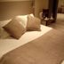 Le Grand Hotel in Maubeuge, guest room with neatly made bed and bedside tray