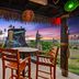 Hilton Garden Inn Kauai Wailua Bay in Kapaa with ocean-view patio seating and sunset