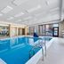 Hampton Inn & Suites Chicago Deer Park indoor pool with large windows and city views