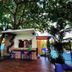 EGI Resort and Hotel in Lapu-Lapu City: poolside bar under trees beside the swimming pool