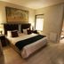 1109 The Decks at 67 Long Street Cape Town bedroom with twin beds, wall art and bedside lamps