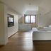Hotel Sanje ob Soci, Bovec: attic room with bed, wood floor, and window with mountain view