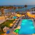 Pavlo Napa Beach Hotel in Ayia Napa with a lit outdoor pool, hot tub, sun loungers and sea view