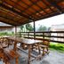 Minshuku Unagi Kohan in Ibusuki outdoor covered picnic area with wooden tables and benches