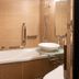 Apa Hotel Roppongi Ekimae bathroom with bathtub, glass sink, and shower in Tokyo