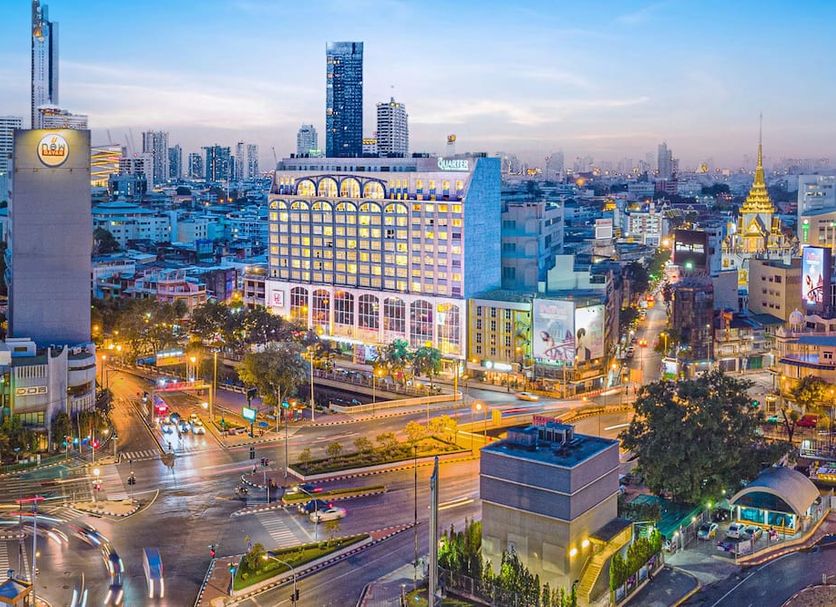 The Quarter Hualamphong By Uhg in Bangkok skyline view with illuminated city streets at dusk