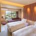 Hakonenomori Okada in Hakone: twin beds in a guest room with mountain view through a large window