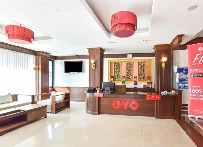 OYO 389 Sira Boutique Residence lobby in Patong with front desk and red pendant lights