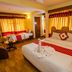 Pilgrims Guest House in Kathmandu room with two beds, warm lighting, and swan towel decor
