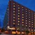 The Lincoln Marriott Cornhusker Hotel in Lincoln exterior at dusk with lit windows and street-level entrance