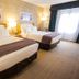 DoubleTree by Hilton Rapid City Downtown Convention Center guest room with two queen beds and window light