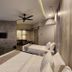 Perkasa Hotel Mt Kinabalu room with two beds, sofa and wall-mounted TV in Kampung Kigiok