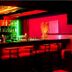 Hotel Sea View in Kanyakumari bar interior with red lighting and illuminated shelves