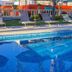 Hotel Del Pescador in Ajijic with outdoor pool and lounge chairs by the water