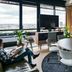 The Social Hub Amsterdam City lounge with city views, round table, TV, and seating in Amsterdam