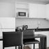 CH Recoleta Suites Buenos Aires kitchen with dining table, refrigerator, microwave, stove and oven