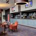 Best Western Aberavon Beach Hotel bar lounge in Port Talbot with tables, chairs and mirrored back bar