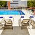 Sercotel Madrid Aeropuerto rooftop pool with lounge chairs in Madrid