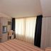 Hotel Concorde Cesenatico room with balcony-style window, desk, and bathroom doorway