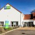 Sure Hotel by Best Western Limoges Sud in Feytiat, exterior with red-tiled roof and entrance drive